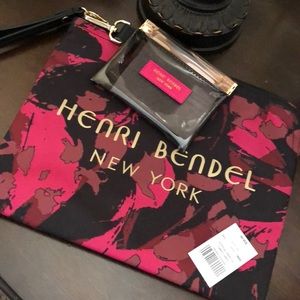 Floral travel pouch with detachable coin purse.